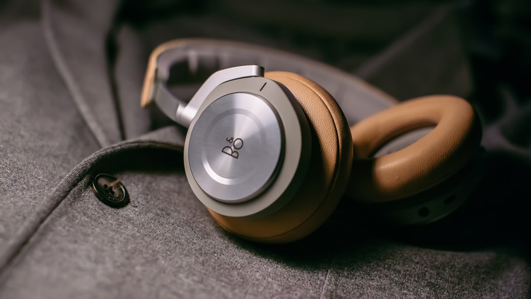 closeup-photo-of-gray-corded-headphones-on-gray-fabric-sheet-kmrtq0-epmg